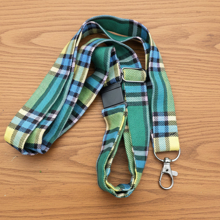 Alberta Tartan Lanyard on a wooden table