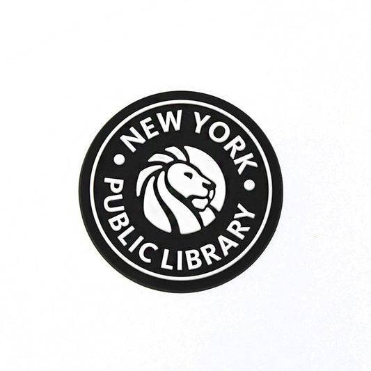 Round black rubber magnet with the New York Public Library logo in white.