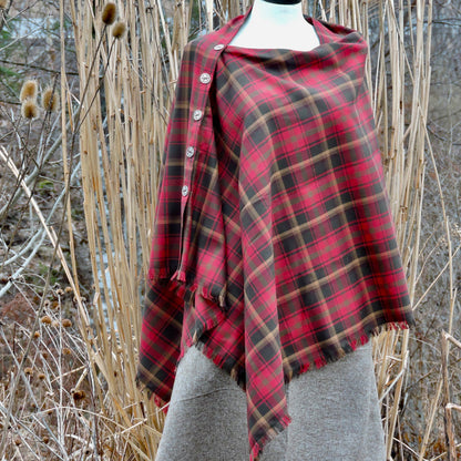 A Maple Leaf Tartan tartan button shawl with pewter buttons displayed on a mannequin.